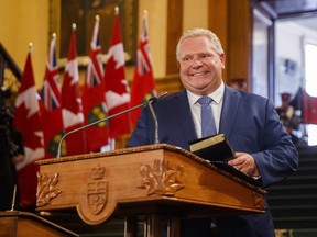 Doug Ford speaks as he is sworn in as premier of Ontario during a ceremony at Queen's Park in Toronto on Friday, June 29, 2018. THE CANADIAN PRESS/Mark Blinch ORG XMIT: MDB124