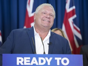 Ontario PC Leader Doug Ford listens to a question following a campaign announcement in Toronto on Monday, June 4, 2018. THE CANADIAN PRESS/Frank Gunn