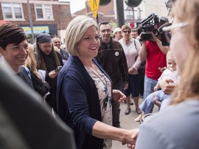 Ontario NDP Leader Andrea Horwath greets supporters during a campaign stop at Blackwater Coffee Co. in Sarnia Ont. on Monday, June 4, 2018. THE CANADIAN PRESS/ Geoff Robins
