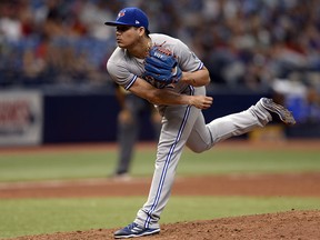 In this May 6, 2018, file photo, Toronto Blue Jays relief pitcher Roberto Osuna throws during a game against the Tampa Bay Rays in St. Petersburg, Fla. (AP Photo/Jason Behnken, File)