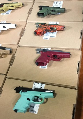 Some of the more colourful guns seized in Project Patton, which targeted the Five Point Generalz street gang, on display at Toronto Police Headquarters on Friday, June 22 2018. (Joe Warmington/Toronto Sun/Postmedia Network)