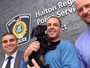 From left: Halton Regional Police Det.-Const. Stephane Berreault. owner Matthew Granger with Tank and Det.-Const. Lee Wood (Joe Warmington, Toronto Sun)