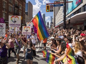 People march during the annual Toronto Pride Parade, in Toronto on Sunday, July 3, 2016.  THE CANADIAN PRESS/Mark Blinch