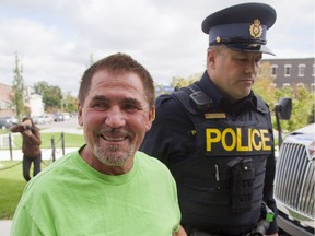 Boris Panovski is walked into the Goderich courthouse for a bail hearing on Monday September 22, 2014. (Free Press file photo)