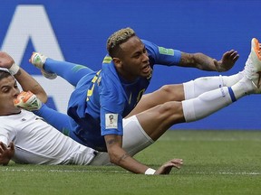 Brazil's Neymar is brought down by Costa Rica's Cristian Gamboa during Group E action at the 2018 World Cup in the Saint Petersburg Stadium in Saint Petersburg, Russia, Friday, June 22, 2018.