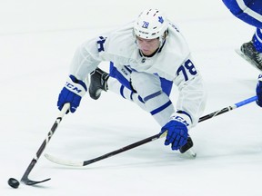 First-round draft pick Rasmus Sandin (78) tries to avoid the checking of Matthew Barnaby Jr., during the Maple Leafs’ development camp yesterday at the MasterCard Centre. Stan Behal/Toronto Sun