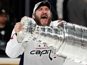 Washington Capitals left wing Alex Ovechkin hoists the Stanley Cup after the Capitals defeated the Golden Knights in Game 5 of the Stanley Cup Final on June 7, 2018