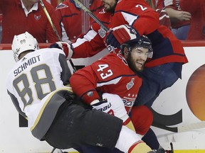 Vegas Golden Knights defenceman Nate Schmidt (left) tangles with Washington Capitals forward Tom Wilson (centre) and defenceman Matt Niskanen during Game 4 last night. (AP)