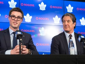 Newly-appointed Toronto Maple Leafs general manager Kyle Dubas, left, sits alongside president and alternate governor Brendan Shanahan during a news conference in Toronto on May 11, 2018
