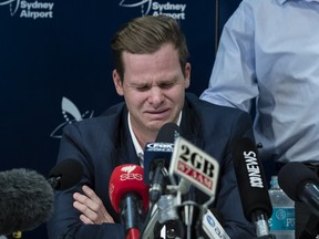 Australian Test cricketer Steve Smith is comforted by his father Peter as he meets the media at Sydney International Airport on March 29, 2018 in Sydney, Australia. Steve Smith, David Warner and Cameron Bancroft were flown back to Australia following investigations into alleged ball tampering in South Africa.  (BROOK MITCHELL/Getty Images)