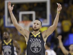 Warriors guard Stephen Curry celebrates during the second half of Game 2 of the NBA Finals against the Cavaliers in Oakland, Calif., Sunday, June 3, 2018.