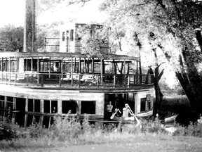 In this photo that I took in the late summer of 1972, the once-proud Toronto Island ferry Trillium awaits a humiliating end as she languishes in a lagoon adjacent to the city’s water filtration plant at Hanlan’s Point. Destined to be shorn of her wooden superstructure, as officials had done with Trillium’s almost identical sister ferry Bluebell, Trillium escaped a similar fate more by good luck than by recognizing the ferry’s heritage. Interestingly, the relatively clean water in the Island lagoon helped preserve Trillium’s hull. According to the project’s engineering consultant and project administrator Gordon Champion the venture to rehabilitate the ferry would have come to an abrupt end had it been discovered that Trillium’s hull been adversely affected by metal deterioration after sitting in stagnant polluted water for almost two decades.