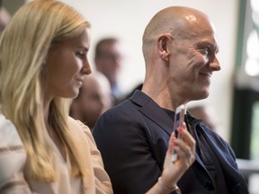 Mats Sundin, right, and his wife Josephine Johansson, watch a video highlighting Sundin's career during a celebration for the Toronto Maple Leafs delivery of the banner honouring Sundin to The Hospital for Sick Children in Toronto on Monday, June 4, 2018. THE CANADIAN PRESS/Tijana Martin