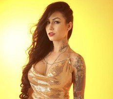 SUNshine Girl Amanda, is our raven-haired tattooed Scorpio who measures in at 5-foot-5 without her stilettos on. She is known as the inkternalbeauty and is back for her fifth Sun shoot. She is a mom who likes the outdoors and especially fishing. She gets her workouts moving 6000 lb bails of paper in the printing pressroom at work. Jack Boland/Toronto Sun/Postmedia Network