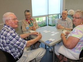 Joe Loney, Sheila MacDonald, Darwin MacDonald and Alice Lamorie enjoy a few rounds of Bridge at the Benson Centre on Thursday June 21, 2018 in Cornwall, Ont. Many seniors participated in The Longest Day of Bridge in support of the Alzheimer Society. (Lois Ann Baker/Cornwall Standard-Freeholder)