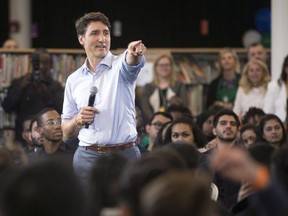 Prime Minister Justin Trudeau takes a question during a town hall Q&A with youth at a hiring fair held in a Toronto Library, on Wednesday, June 27, 2018.