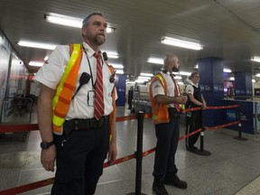 TTC employees redirect passengers away from a closed track where a murder occurred on Monday June 18, 2018. Stan Behal/Toronto Sun