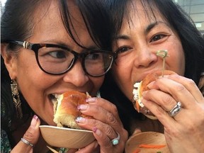 Sisters Olivia Lorenz and Sonia Velasco enjoy the Hamburger Hop event during Chicago’s Gourmet Festival.