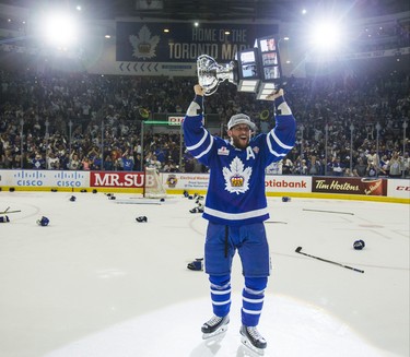 Toronto Marlies Richard Clune hoists up theCalder Cup after defeating Texas Stars in Game 7 at the Ricoh Coliseum in Toronto, Ont. on Thursday June 14, 2018. Ernest Doroszuk/Toronto Sun/Postmedia