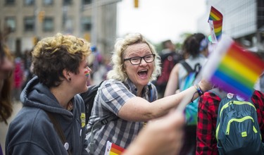 Cheering on the Dyke March 2018 on Church St. and Bloor St. E in downtown Toronto, Ont. on Saturday June 23, 2018. Ernest Doroszuk/Toronto Sun/Postmedia