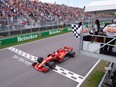 Ferrari's Sebastian Vettel of Germany crosses the finish line to win the Canadian Grand Prix Sunday, June 10, 2018 in Montreal.