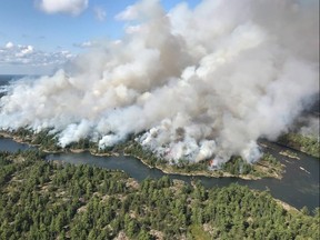 An aerial view taken over the Parry Sound 33 fire is shown in this handout image. THE CANADIAN PRESS/HO-AFFES Ignition/Response Specialist-Dan Leonard