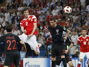Russia's Mario Fernandes (centre) scores the game-tying goal against Croatia on Saturday. (AP PHOTO)