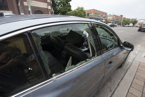 The shattered window of a car parked along Danforth Ave. (Craig Robertson/Toronto Sun)
