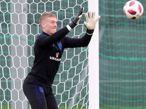 England's Jordan Pickford makes a save during a training session on Tuesday. (GETTY IMAGES)