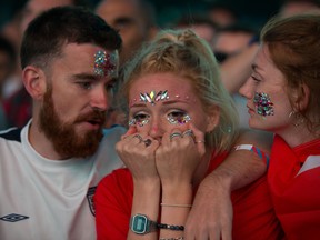 An English fan shows her disappointment while watchingg Wednesday's game against Croatia. (WENN.COM)