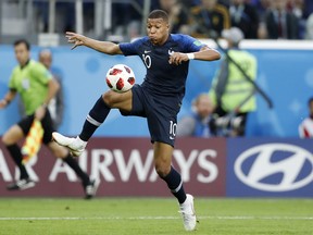France's Kylian Mbappe controls the ball during the semifinal match against Belgium on Tuesday. (AP PHOTO)