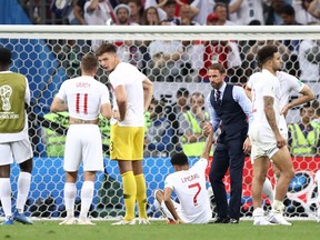 England manager Gareth Southgate and his players stand in front of the crowd after Wednesday's loss to Croatia. (GETTY IMAGES)