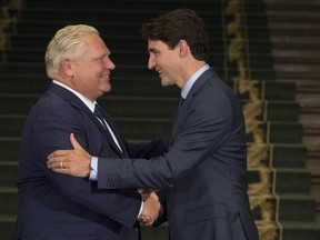 Premier Doug Ford (L) and Prime Minister Justin Trudeau meet at Queen’s Park on July 5.(STAN BEHAL, Toronto Sun)