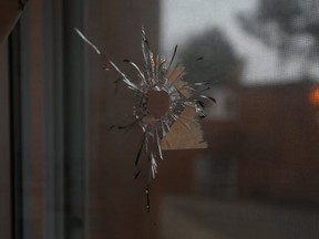 A bullet hole through a kitchen window earlier this year at a home at the Ardwick Blvd TCHC housing complex. (JACK BOLAND, Toronto Sun)