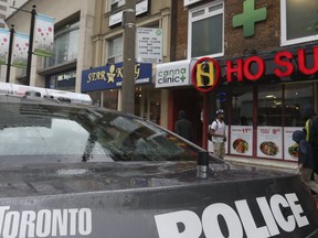 Police raid a pot shop in the Yonge St.-Eglinton Ave. area in June, 2017. (STAN BEHAL, Toronto Sun)