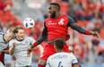 Toronto FC's Jozy Altidore battles for the ball against the Chicago Fire during Saturday's game at BMO Field. (THE CANADIAN PRESS)