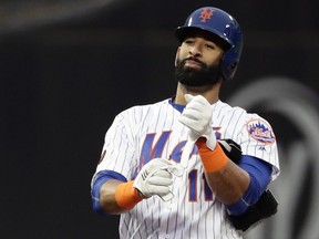 In this May 22, 2018, file photo, New York Mets' Jose Bautista gestures to teammates after hitting a double during the second inning of a baseball game against the Miami Marlins, in New York. (AP Photo/Frank Franklin II, File)