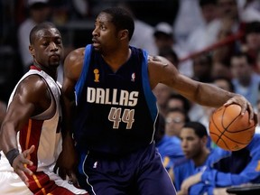 Adrian Griffin #44 of the Dallas Mavericks posts up Dwyane Wade #3 of the Miami Heat in the second quarter of game five of the 2006 NBA Finals on June 18, 2006 at American Airlines Arena in Miami, Florida.