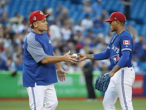 Marcus Stroman #6 of the Toronto Blue Jays hands the baseball to manager John Gibbons #5 as he is relieved in the fifth inning during MLB game action against the New York Mets at Rogers Centre on July 4, 2018 in Toronto, Canada. (Photo by Tom Szczerbowski/Getty Images)