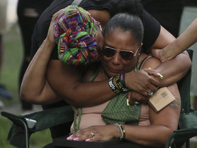 Friends and family gather for a vigil for rapper Smoke Dawg,21-year-old Jahvante Smart, on Monday July 2, 2018. The rapper was killed outside of a Toronto nightclub on Saturday. Veronica Henri/Toronto Sun