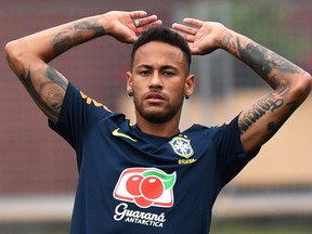 Brazil's forward Neymar stretches during a training session at Yug Sport Stadium, in Sochi, on July 4, 2018, during the Russia 2018 World Cup football tournament. NELSON ALMEIDA/AFP/Getty Images