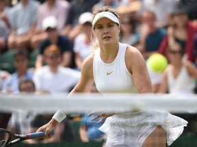 Canada's Eugenie Bouchard returns to Australia's Ashleigh Barty in their women's singles second round match on the fourth day of the 2018 Wimbledon Championships at The All England Lawn Tennis Club in Wimbledon, southwest London, on July 5, 2018. (Oli Scarff/Getty Images)