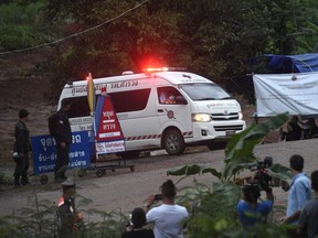 An ambulance leaves the Tham Luang cave area as divers evacuated some of the 12 boys and their coach trapped for the past two weeks.
(LILLIAN SUWANRUMPHA/AFP)