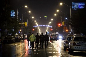 Toronto Police officers work on Danforth St., at the scene of a shooting in Toronto, Ontario, Canada on July 23, 2018. COLE BURSTON/AFP/Getty Images