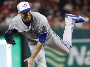 Toronto Blue Jays pitcher J.A. Happ  throws in the tenth inning during the Major League Baseball all-star game on Tuesday in Washington. Happ earned the win as the AL won 8-6.  (AP Photo/Patrick Semansky)