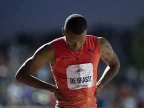 Andre De Grasse looks on after competing in the senior men's 100-metre dash at the Canadian track and field Championships in Ottawa on Friday, July 6, 2018. De Grasse sustained an injury on Saturday. (JUSTIN TANG/THE CANADIAN PRESS)