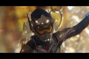 Evangeline Lilly’s Wasp dangles from a chandelier in a scene from Marvel’s Ant-Man and the Wasp. (Marvel Studios)