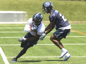 Toronto Argonauts' Llevi Noel WR (84) makes a sideline catch in front of teammate Ronnie Yell during practice at Lamport Stadium in Toronto. Jack Boland/Toronto Sun