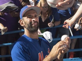 New York Mets Jose Bautista signs autographs for fans prior to the start of the Mets interleague MLB baseball game against the Blue Jays in Toronto on Tuesday, July 3, 2018.