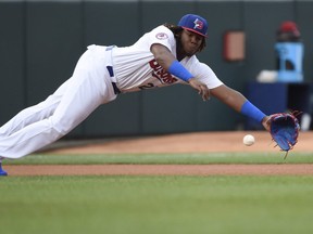 Buffalo Bisons third baseman Vladimir Guerrero Jr. (27) dives for the ball but can't make the catch on a single by Lehigh Valley IronPigs right fielder Aaron Altherr during first inning triple-A baseball action in Buffalo on Tuesday, July 31, 2018. Guerrero Jr. is making his triple-A debut after dominating double-A over 61 games. THE CANADIAN PRESS/Nathan Denette